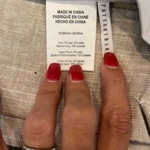 Oatmeal linen blackout Pottery Barn drapes.